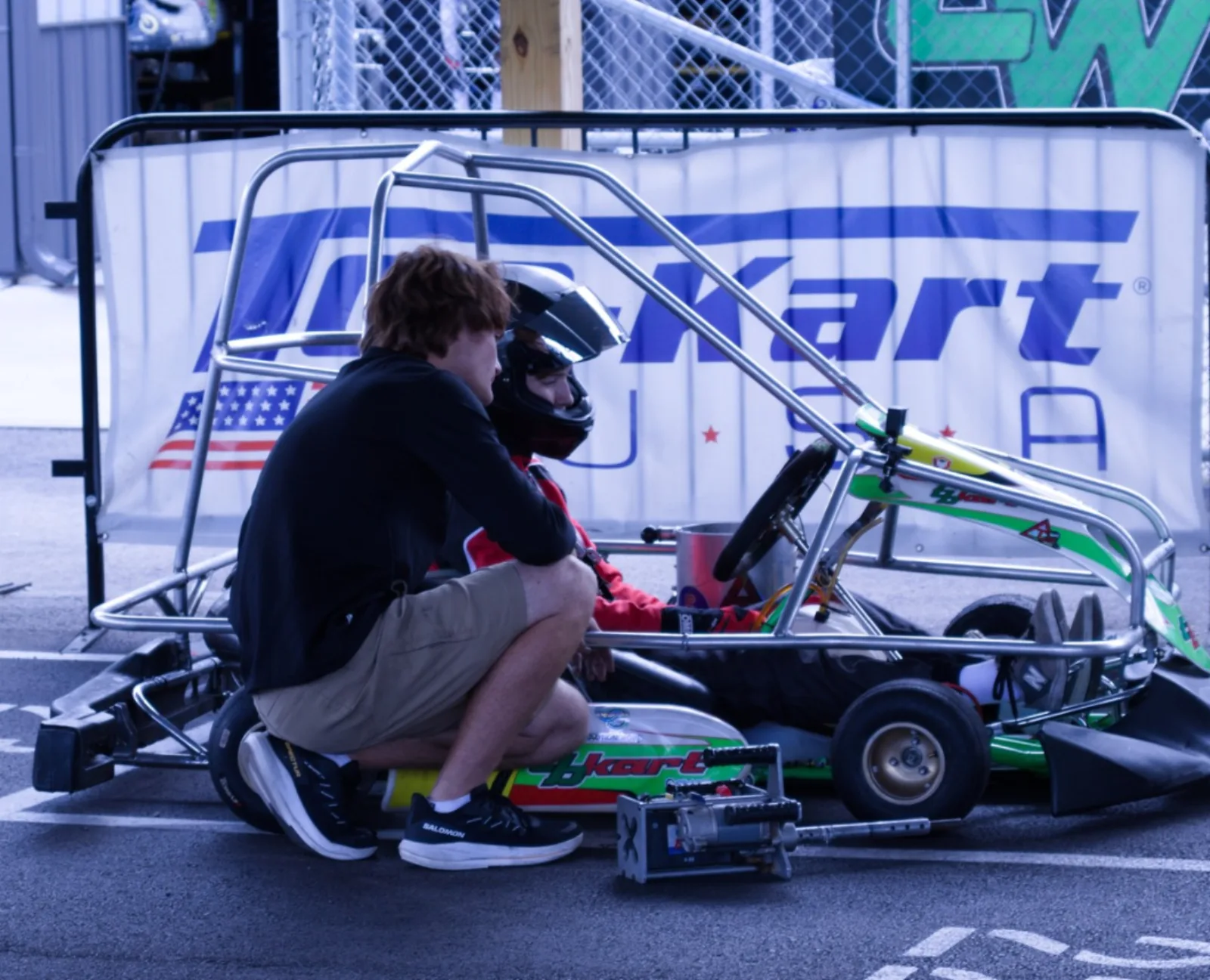 Triangle Racing crew preparing the kart in the pits